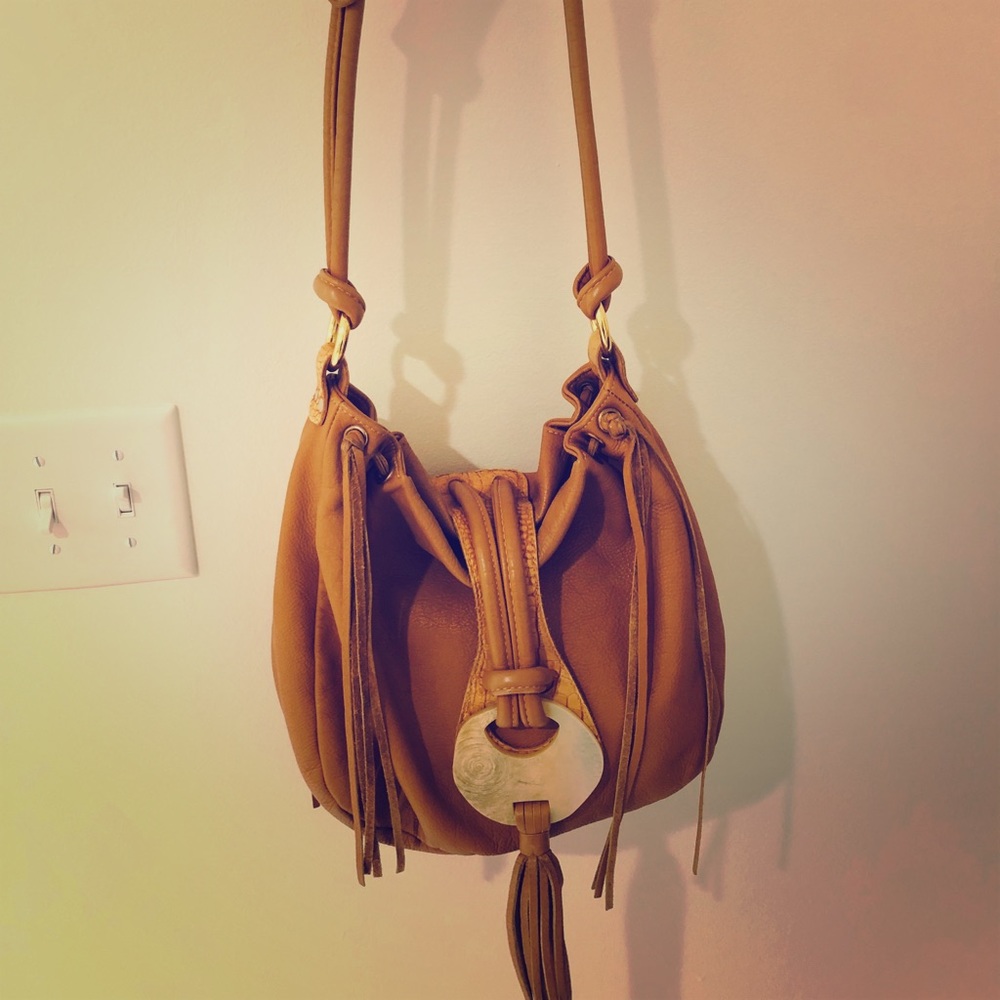 Tan leather handbag with shell and tassel detail